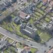Oblique aerial view of the Chapel of our Lady of the Assumption and St Meddan Church, looking SSW.