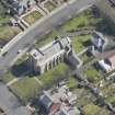 Oblique aerial view of the Chapel of our Lady of the Assumption and St Meddan Church, looking ESE.