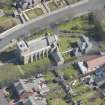 Oblique aerial view of the Chapel of our Lady of the Assumption and St Meddan Church, looking ENE.