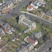 Oblique aerial view of the Chapel of our Lady of the Assumption and St Meddan Church, looking NNE.