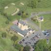 Oblique aerial view of Pitfirrane Castle, looking NW.