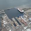 Oblique aerial view of Rosyth Naval Dockyard showing the construction of two aircraft carriers, looking WSW.