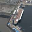 Oblique aerial view of the Main Basin, Rosyth Naval Dockyard showing the construction of an aircraft carrier, looking N.