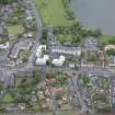 Oblique aerial view of Linlithgow High Street and West Port House, looking NNW.