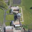Oblique aerial view of Blackburn House, East Pavilion and West Pavilion, looking ENE.