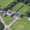 Oblique aerial view of Clifton Hall, stables and dovecot, looking SW.