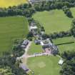 Oblique aerial view of Clifton Hall, stables and dovecot, looking SSE.