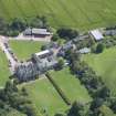 Oblique aerial view of Clifton Hall, stables and dovecot, looking E.
