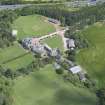 Oblique aerial view of Clifton Hall, stables and dovecot, looking N.