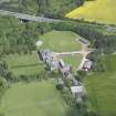 Oblique aerial view of Clifton Hall, stables and dovecot, looking NNW.