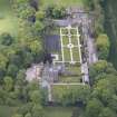 Oblique aerial view of Carlowrie Country House, walled garden, main stable block and Westfield Steading, looking SW.