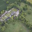 Oblique aerial view of Carlowrie Country House, walled garden, main stable block and Westfield Steading, looking N.