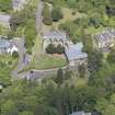 Oblique aerial view of Colinton Parish Church, burial ground and Colinton Manse, looking NNW.