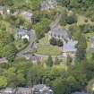 Oblique aerial view of Colinton Parish Church, burial ground and Colinton Manse, looking NW.