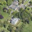 Oblique aerial view of Mortonhall House, terraced garden, stable court and granary, looking NE.