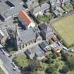 Oblique aerial view of St John and King's Church, looking E.