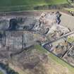 Oblique aerial view of the demolition works at the Alnwickhill Reservoir and Waterworks, looking NNE.
