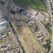 Oblique aerial view of the demolition works at the Alnwickhill Reservoir and Waterworks, looking N.