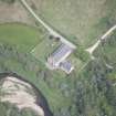 Oblique aerial view of Tombae Roman Catholic Church of the Incarnation and burial ground, looking NE.