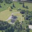 Oblique aerial view of Ballindalloch Castle, looking SW.