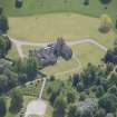 Oblique aerial view of Ballindalloch Castle, looking SSE.