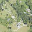Oblique aerial view of Ballindalloch Castle and dovecot, looking NNE.