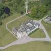 Oblique aerial view of Ballindalloch Castle, looking NW.