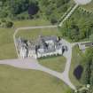 Oblique aerial view of Ballindalloch Castle, looking NW.