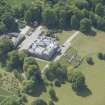 Oblique aerial view of Aberlour House and Column, looking S.