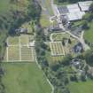 Oblique aerial view of Mortlach Parish Church, burial gounds and watch house, looking SW.