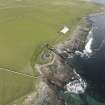 Oblique aerial view of Mid Howe broch, looking SE.