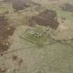 Oblique aerial view of the farmstead at Tafts, looking ESE.