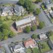 Oblique aerial view of Finnart St Paul's Church of Scotland, looking NE.