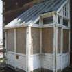 Detail of wooden porch on west elevation..