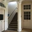 General view of ground floor staircase and adjacent doorways.