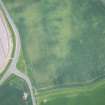 Oblique aerial view of the cropmarks of the rectilinear settlement, looking N.