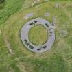 Oblique aerial view of Edin's Hall centred on the broch, looking N.