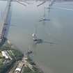 Oblique aerial view of the construction of the Queensferry Crossing and Forth Road Bridge, looking S.