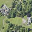 Oblique aerial view of Newliston House, stables and coach house, looking SW.