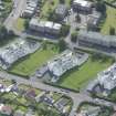 Oblique aerial view of 1-48 Ravelston Garden, looking SE.