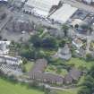Oblique aerial view of Roseburn Primary School and Roseburn House, looking SE.