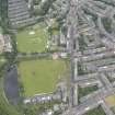 Oblique aerial view of Comely Bank Road and Edinburgh Academicals Cricket Ground, looking ESE.