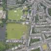 Oblique aerial view of Comely Bank Road and Edinburgh Academicals Cricket Ground, looking E.