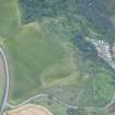 Oblique aerial view of the cropmarks of the possible sunken floored building and pits, looking WSW.