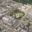 Oblique aerial view of South St Andrew Street, Princes Street and St Andrew Square, looking WNW.