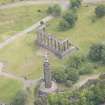 Oblique aerial view of the Calton Hill National Monument and Nelson's Monument, looking NE.