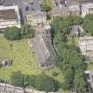 Oblique aerial view of Trinity House and South Leith Parish Church and Churchyard, looking WNW.