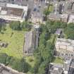 Oblique aerial view of Trinity House and South Leith Parish Church and Churchyard, looking W.