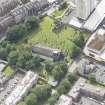 Oblique aerial view of Trinity House and South Leith Parish Church and Churchyard, looking SSE.