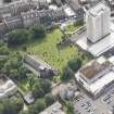 Oblique aerial view of Trinity House and South Leith Parish Church and Churchyard, looking SE.